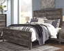 Wynnlow King Crossbuck Panel Bed with Mirrored Dresser, Chest and 2 Nightstands Huntsville Furniture Outlet