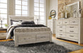 Bellaby Queen Panel Headboard with Mirrored Dresser, Chest and Nightstand Huntsville Furniture Outlet