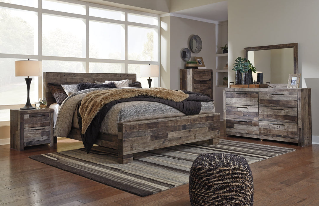 Derekson King Panel Bed with Mirrored Dresser, Chest and Nightstand Huntsville Furniture Outlet