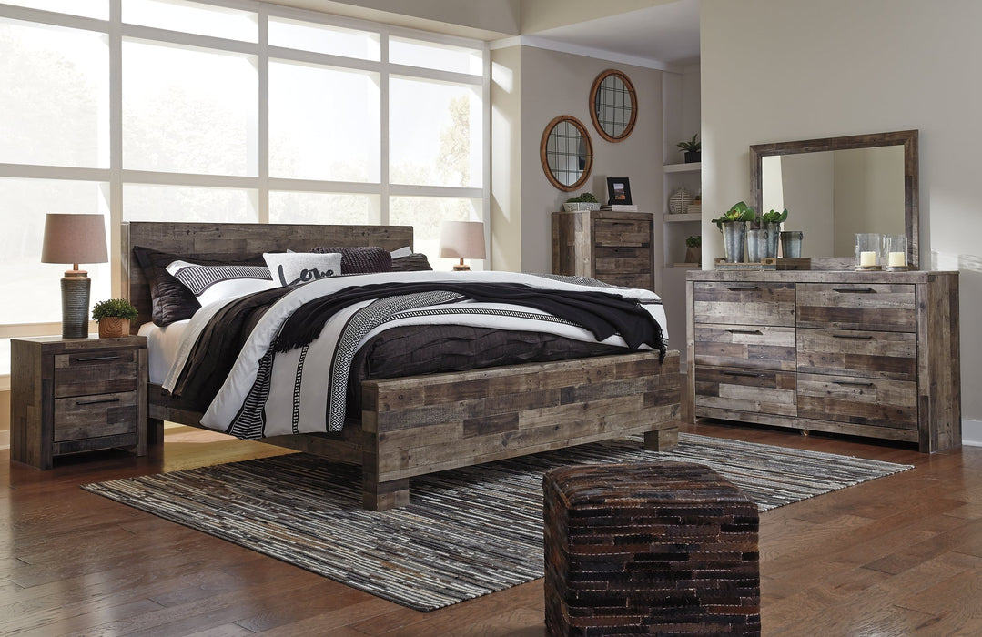 Derekson King Panel Bed with Mirrored Dresser, Chest and Nightstand Huntsville Furniture Outlet