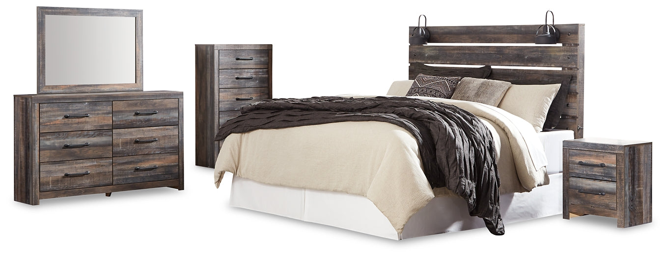 Drystan King Panel Headboard with Mirrored Dresser, Chest and Nightstand Huntsville Furniture Outlet