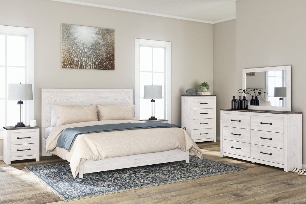 Gerridan King Panel Bed with Mirrored Dresser, Chest and Nightstand Huntsville Furniture Outlet