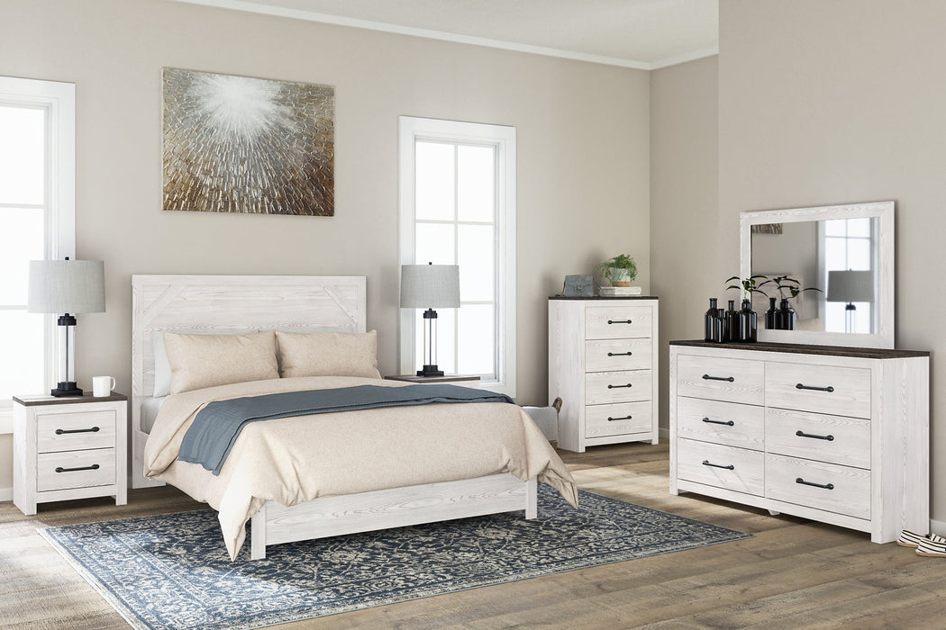 Gerridan Queen Panel Bed with Mirrored Dresser, Chest and 2 Nightstands Huntsville Furniture Outlet