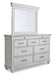 Kanwyn King Panel Bed with Mirrored Dresser and Chest Huntsville Furniture Outlet