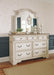 Realyn Queen Upholstered Panel Bed with Mirrored Dresser and Chest Huntsville Furniture Outlet